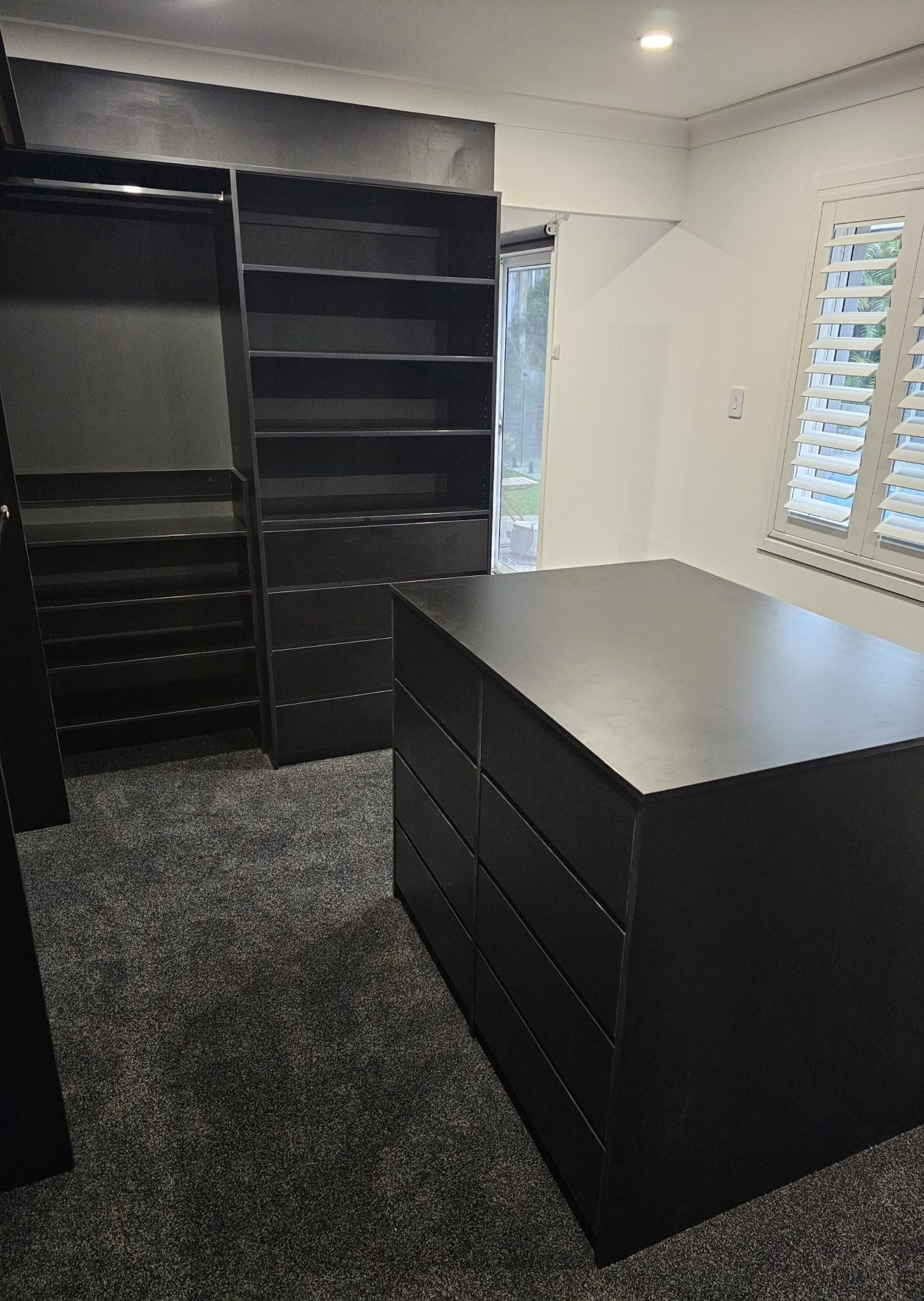 Walk-in robe and island drawers in black