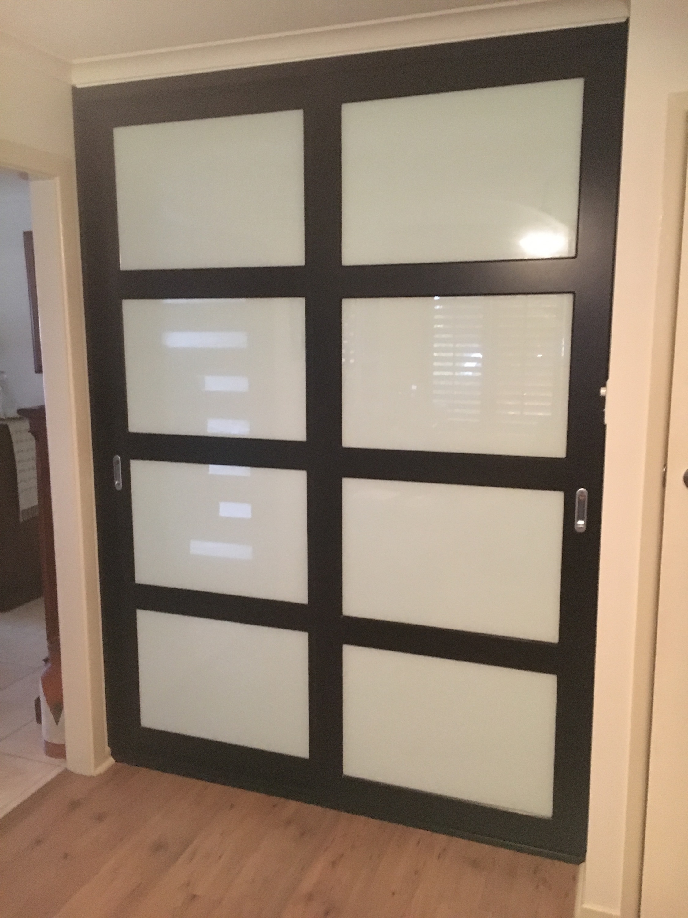 Black Vinyl Wrapped Doors With Optipanel Glass Inserts Lifestyle