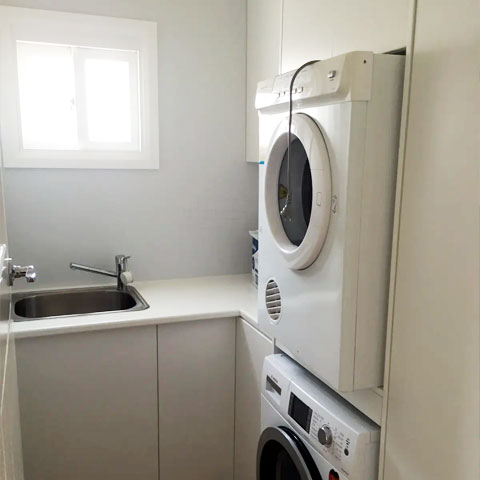 Laundry storage with sink and appliances