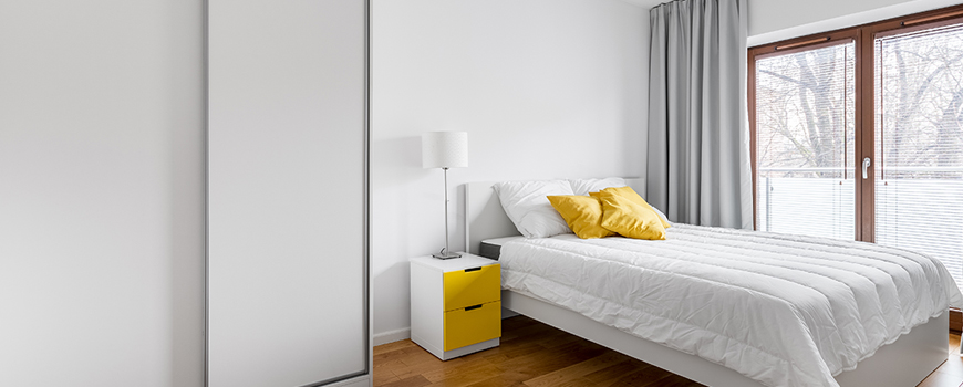 bedroom wordrobe picture with yellow cushions