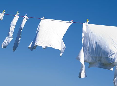 White clothing on a clothes line with a blue sky