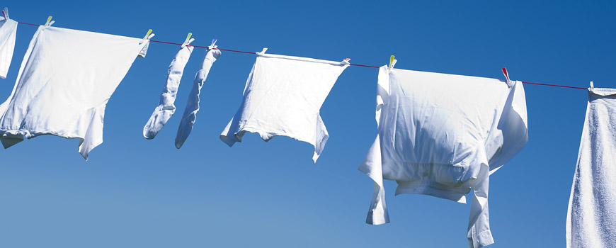 White clothing on a clothes line with a blue sky